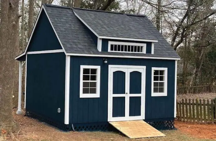 The Pinnacle Line storage building — steep 12/12 roof, luxury estate look
